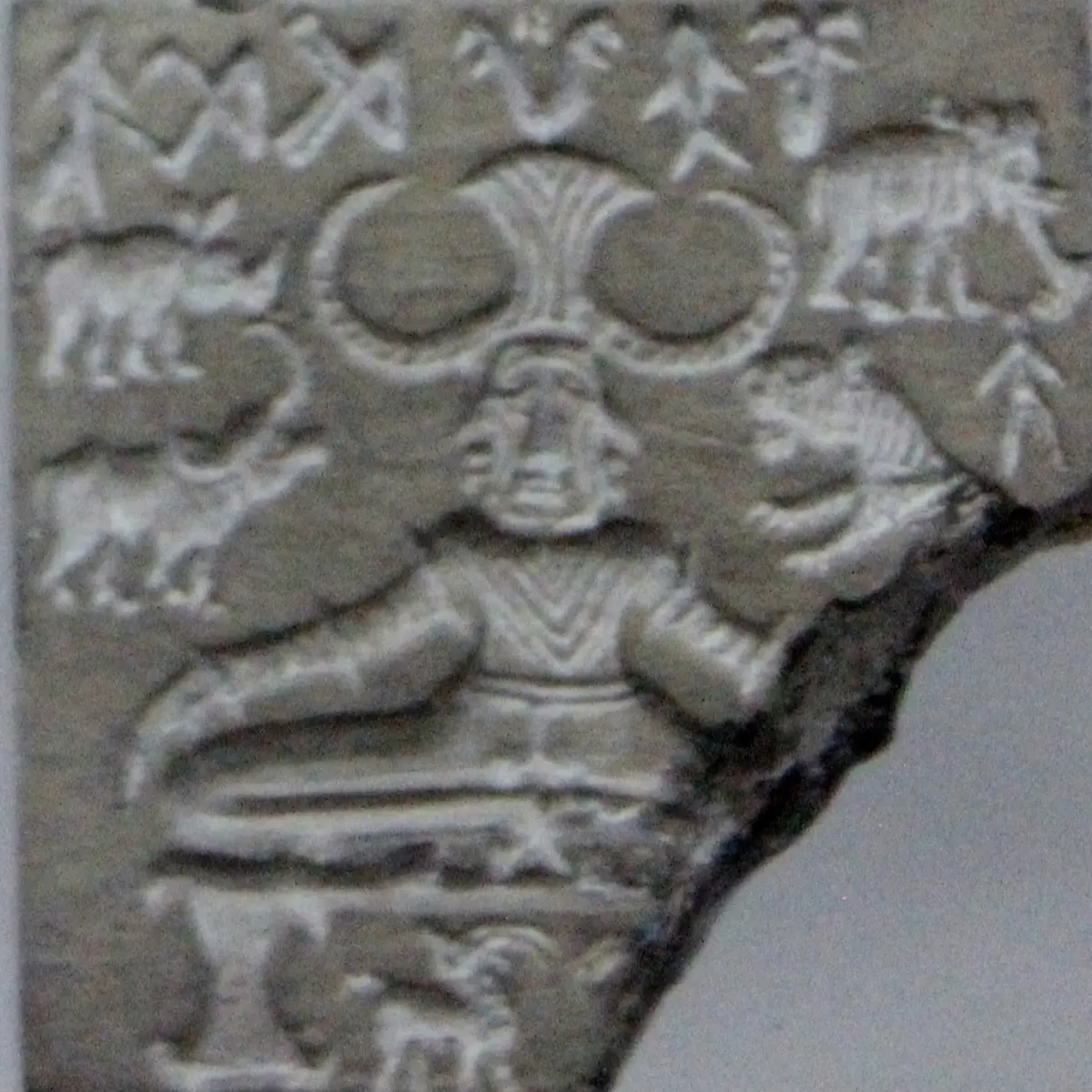 The so-called Pashupati seal from Mohenjo-daro, about 4,000 years old: a horned figure seated with bent legs, surrounded by animals, at the National Museum, New Delhi