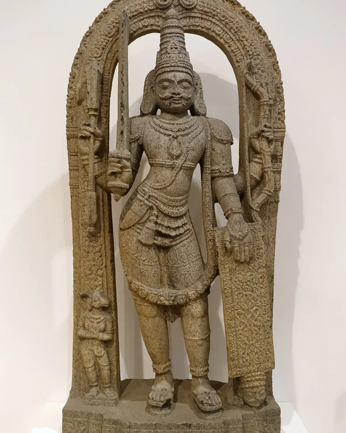 Stone sculpture of Virabhadra from Karnataka, 16th century, standing with sword and shield, the warrior Shiva created to avenge Sati (Dallas Museum of Art)